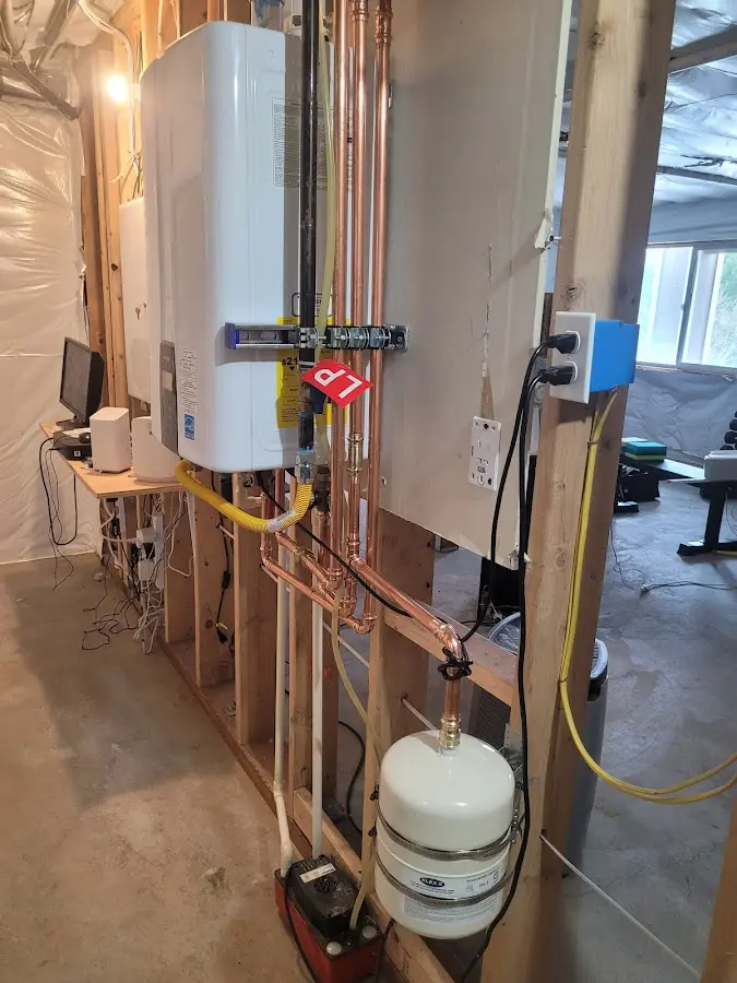 Licensed plumber repairing a kitchen sink in Mattoon